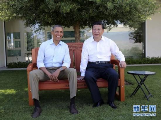 U.S. President Obama sits with President Xi on a gift bench made out of California redwood before their second meeting on the morning of June 8, 2013 at The Annenberg Retreat at Sunnylands in Rancho Mirage, California. [Photo/Xinhua]