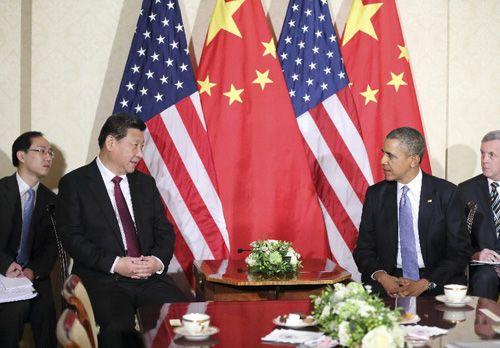 Chinese President Xi Jinping and U.S. President Barack Obama meet in The Hague, Netherlands on March 24, 2014 ahead of the Nuclear Security Summit. [Photo/ Xinhua]